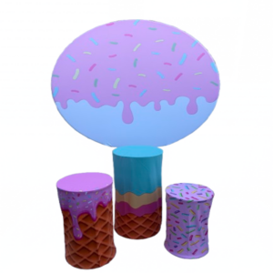 Ice cream backdrop rental with sprinkle design and waffle cone pedestals for birthday party decoration